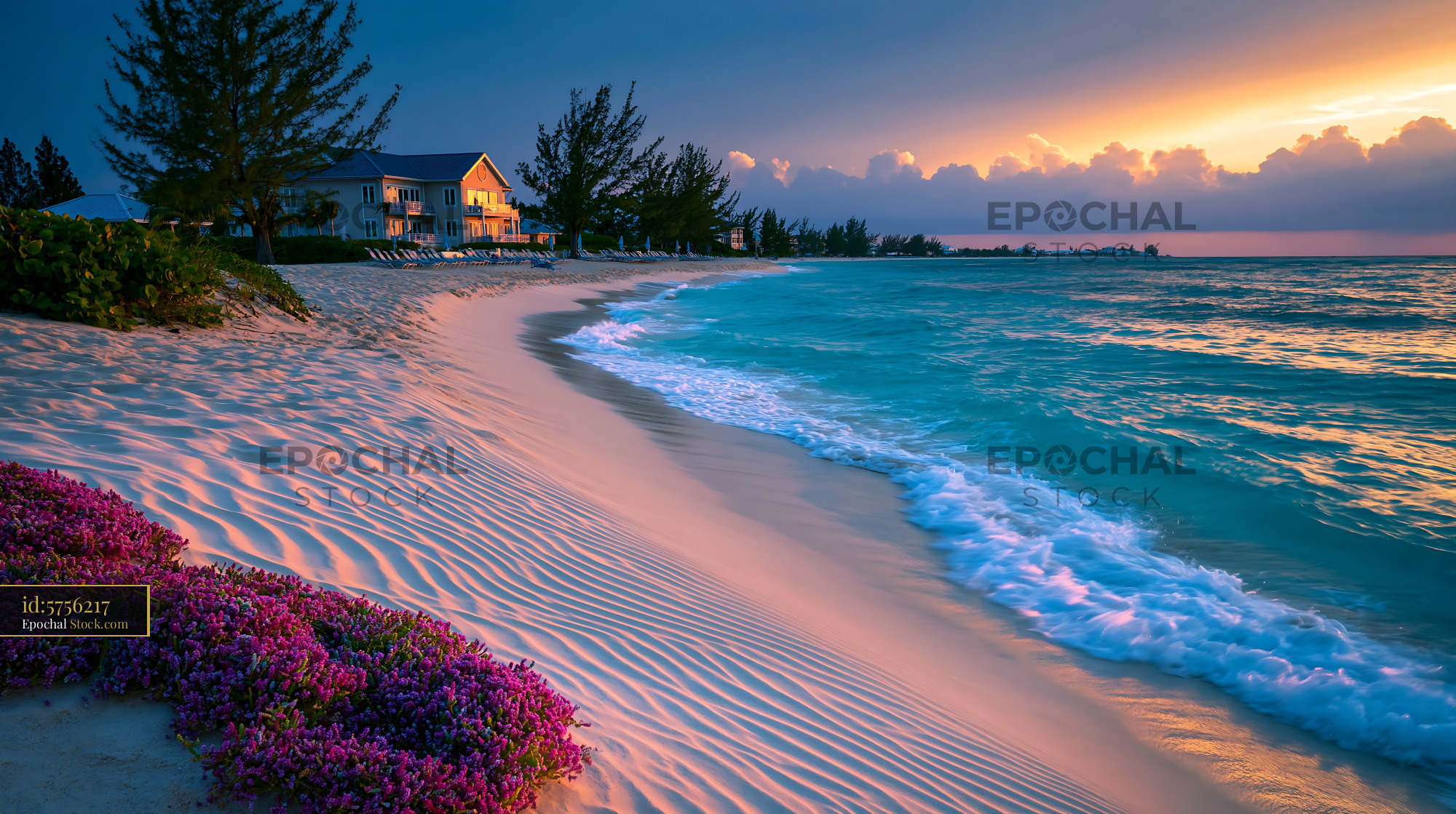 Luxury beach resort with turquoise water and white sand at sunset - stock photo