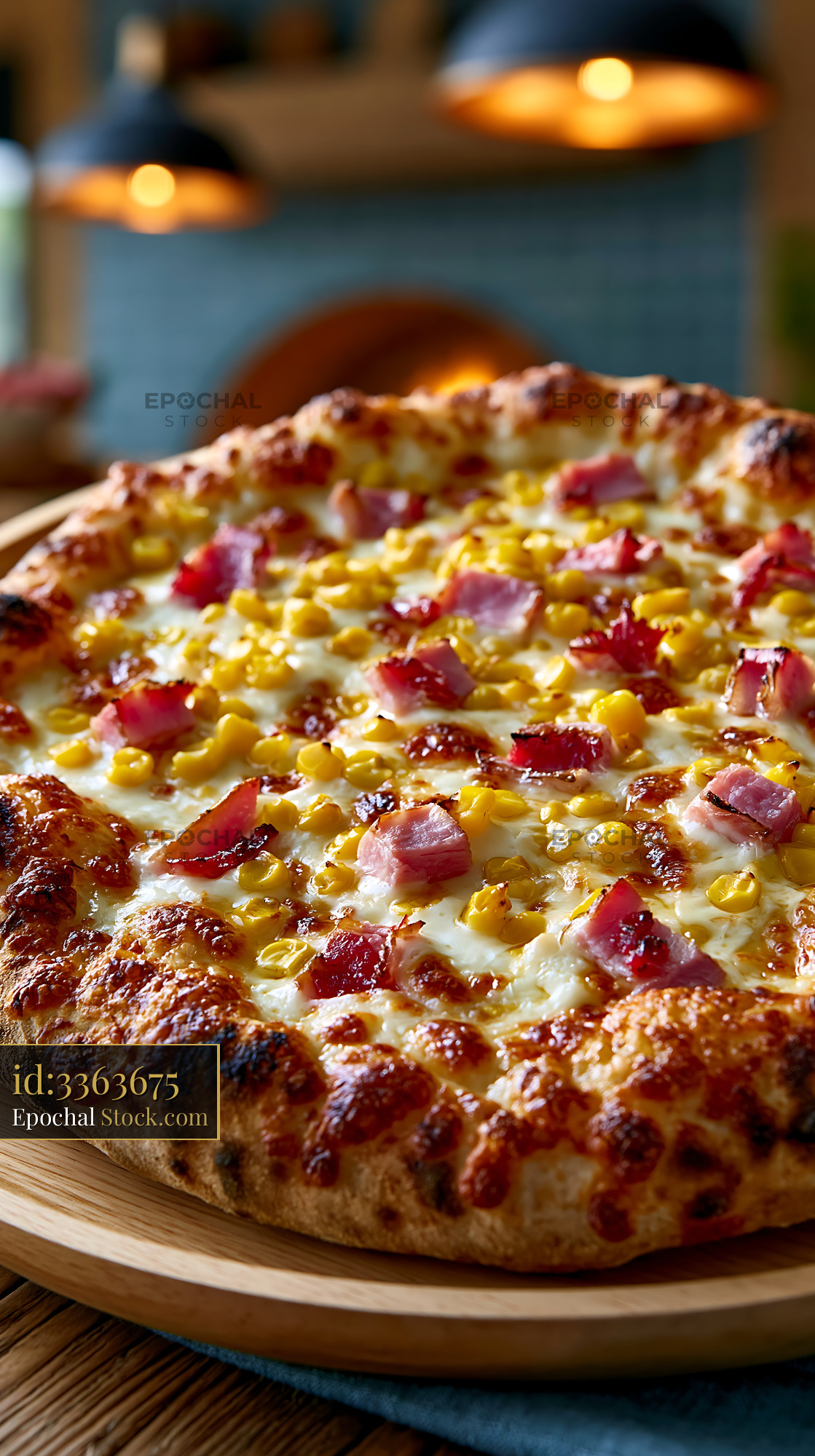 Gourmet panna mais pizza with ham and sweet corn on wooden board - stock photo