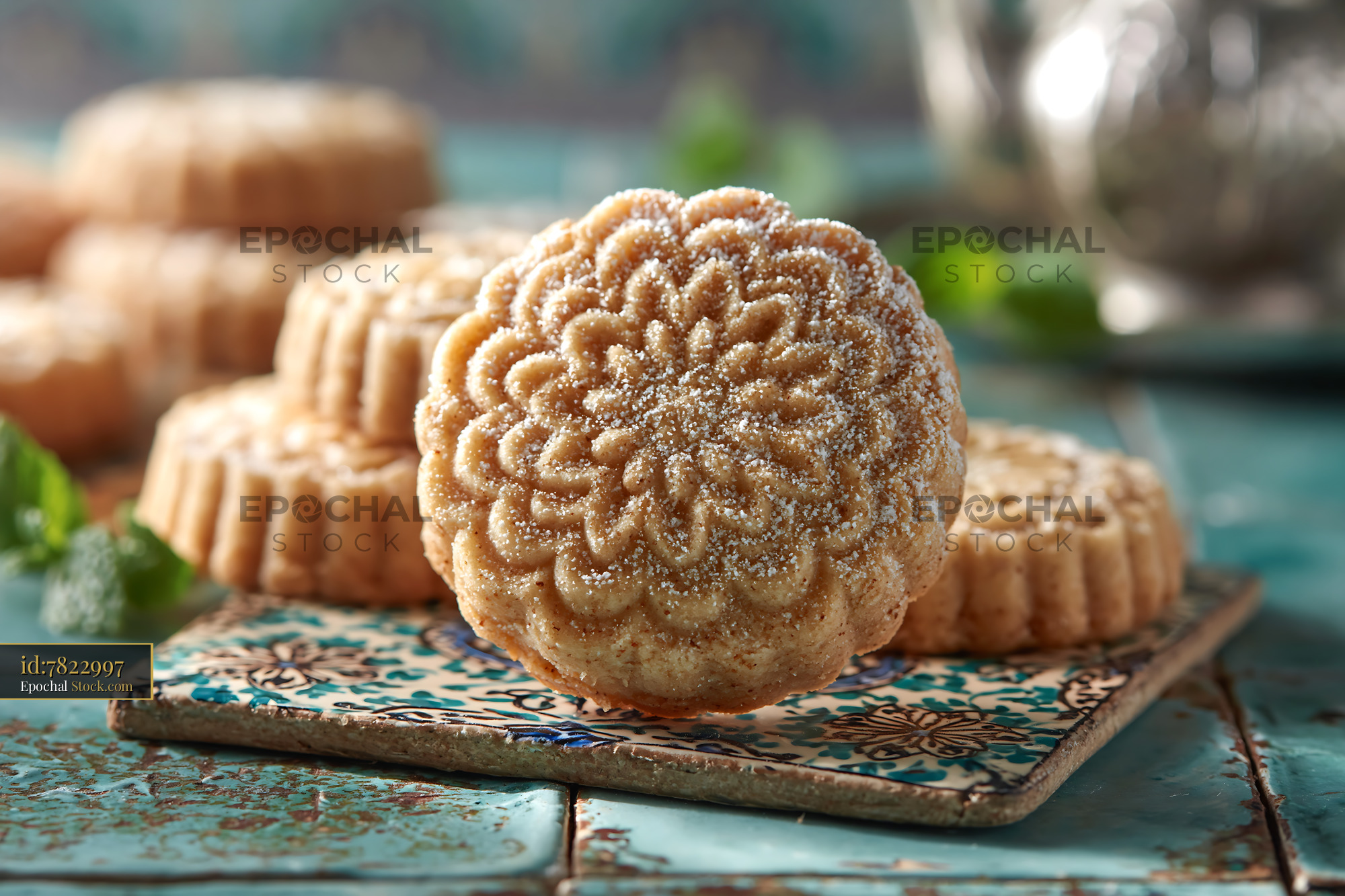 Traditional mahlab spice biscuits on decorative turquoise tiles - stock photo