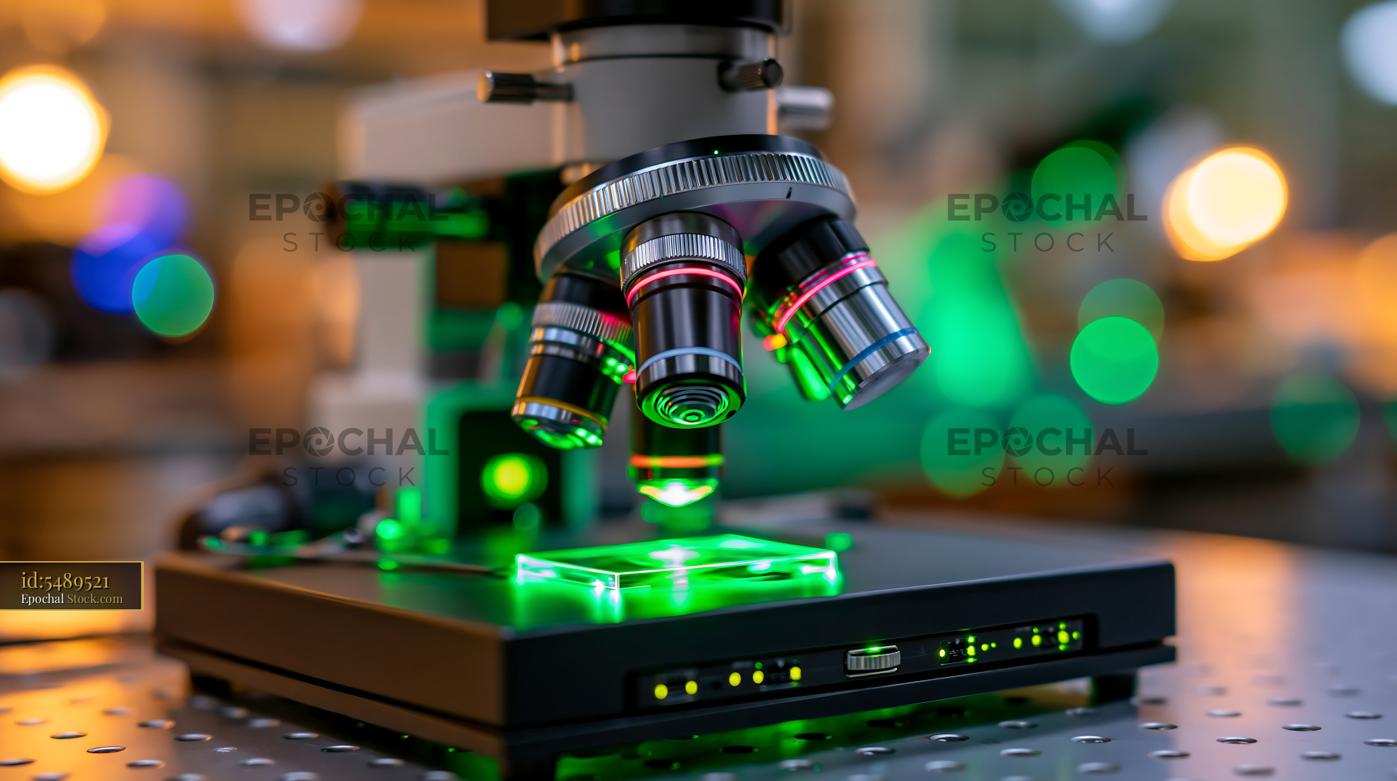 Professional microscope with green fluorescent light in a modern lab - stock photo