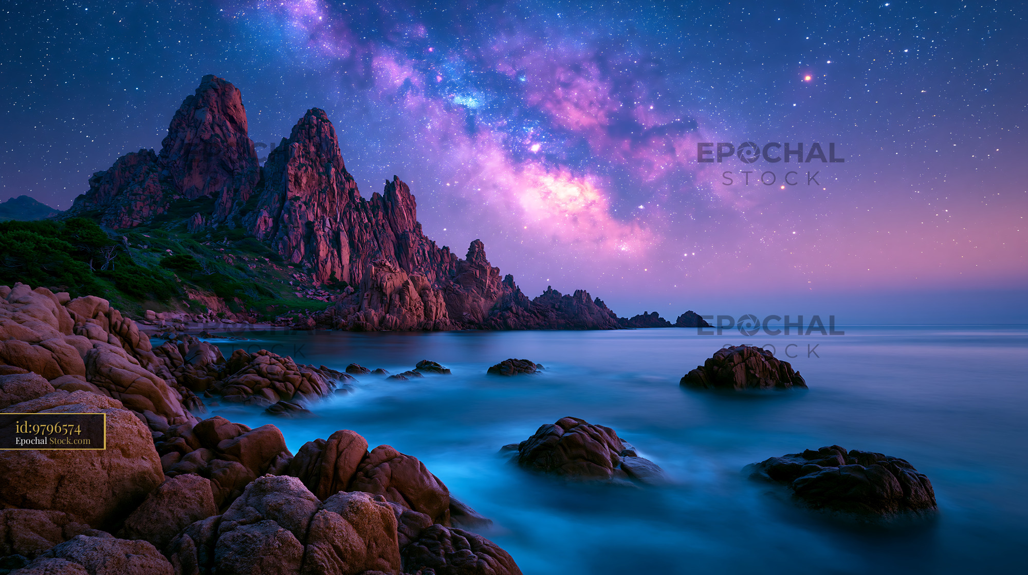 Milky Way over a rocky sahara oasis night with calm water - stock photo