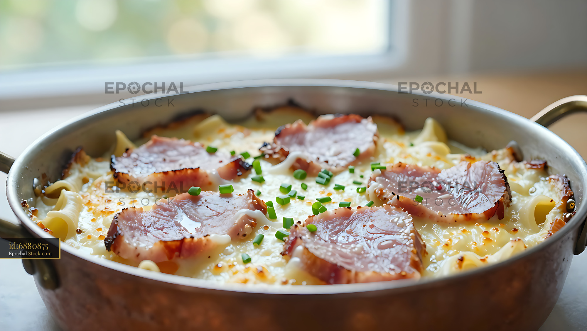 Traditional Wiener Schinkenfleckerl ham and pasta bake in copper pan - stock photo