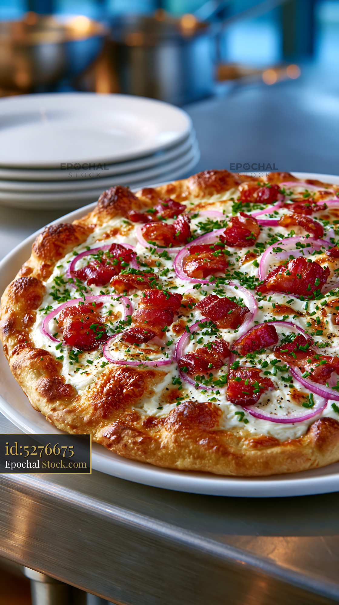 Freshly baked flammkuchen pizza with crispy bacon and red onions - stock photo