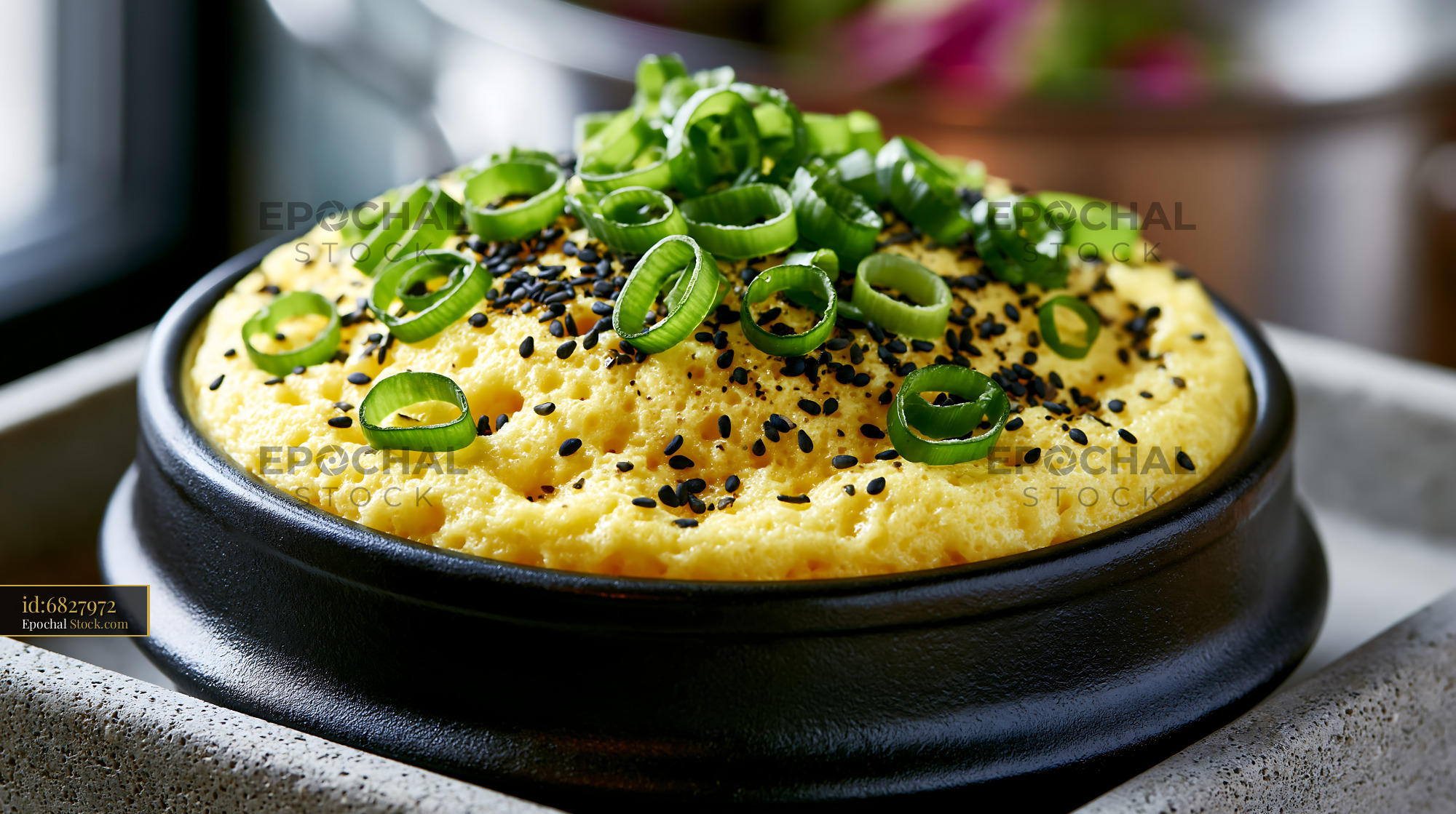 Traditional gyeran-jjim Korean steamed egg topped with green onions - stock photo