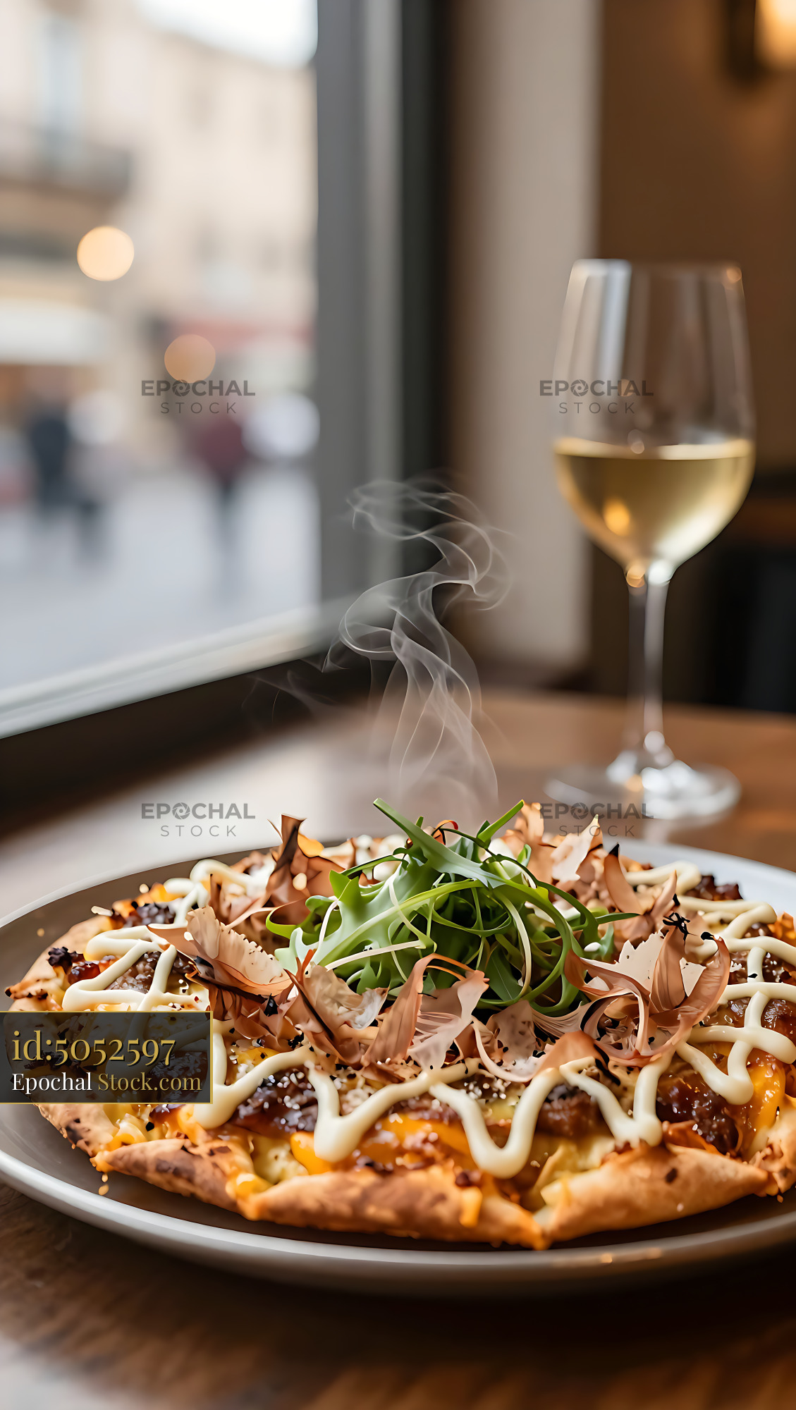 Steaming hot Japanese okonomiyaki pizza hybrid served with white wine - stock photo