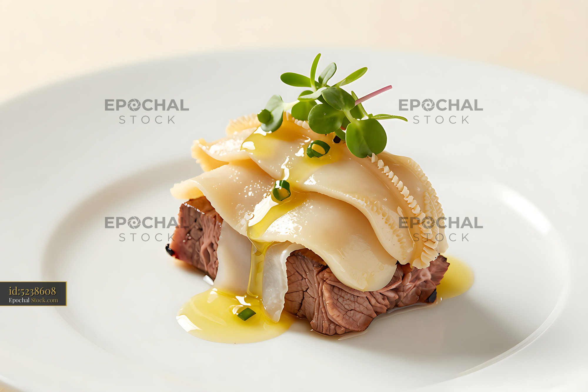 Gourmet beef tenderloin topped with geoduck clam and microgreens - stock photo