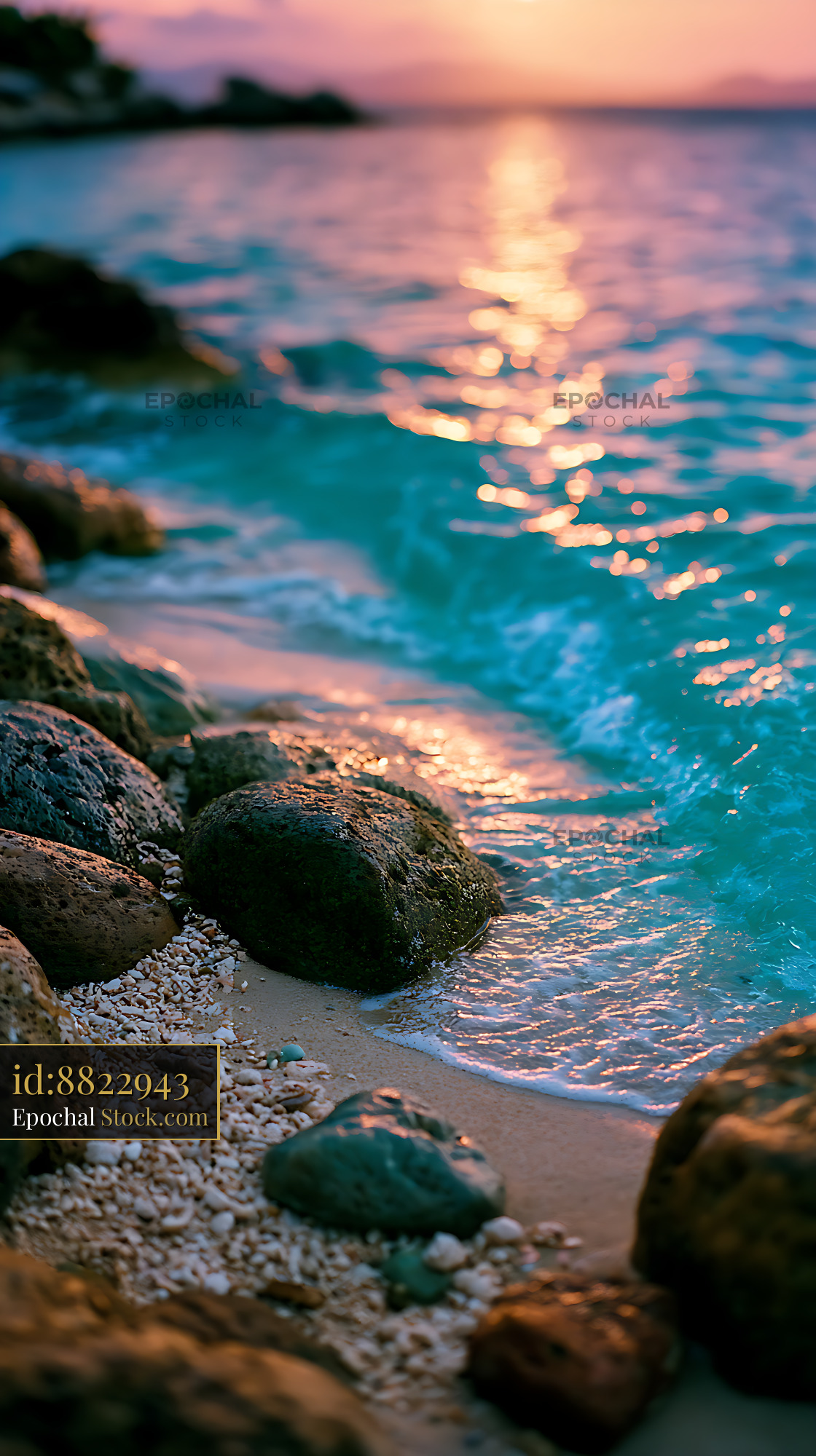 Historic stone shore of Pigeon Island at sunset with turquoise waves - stock photo