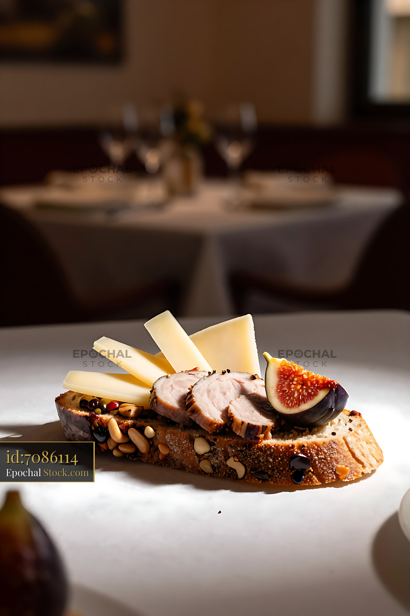 Buendner Schinken on Birnbrot with cheese and fig in fine dining setti - stock photo