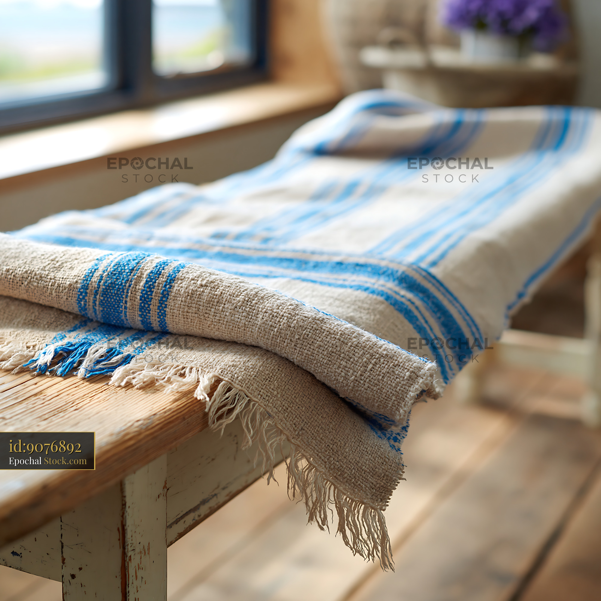 Linen shabby chic bench blanket on rustic wooden furniture - stock photo