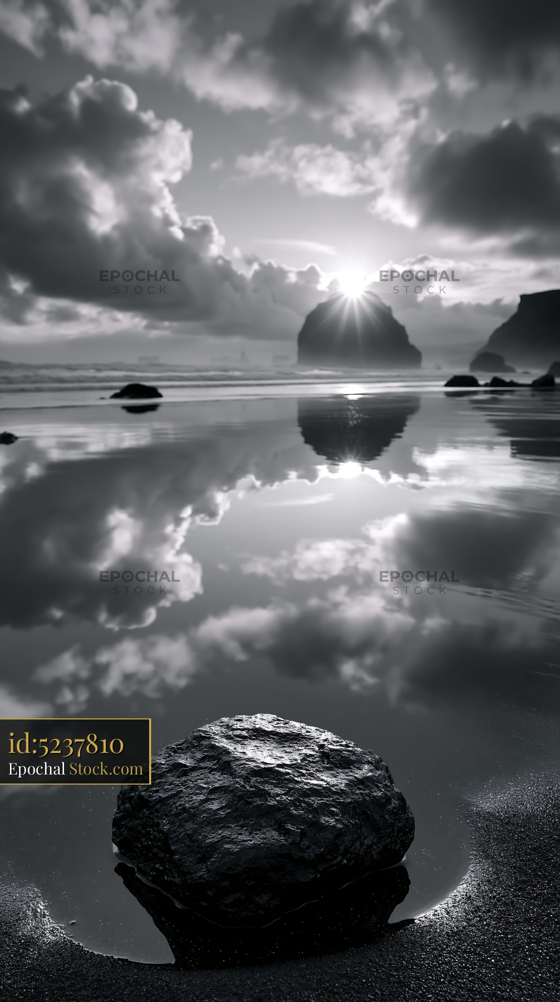 Dramatic black and white sunset at Cannon Beach with sea stack - stock photo