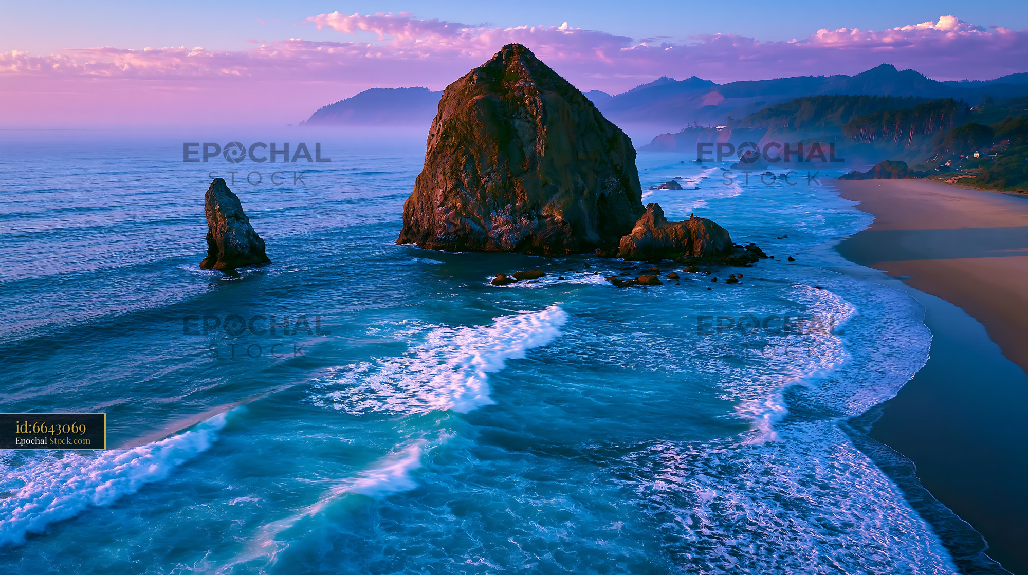 Cannon Beach aerial view of Haystack Rock at sunset with purple sky - stock photo