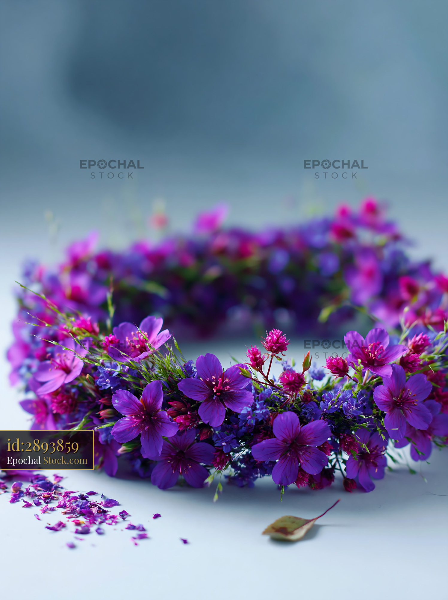 Delicate purple meadow flower crown made of wild geraniums and grass - stock photo