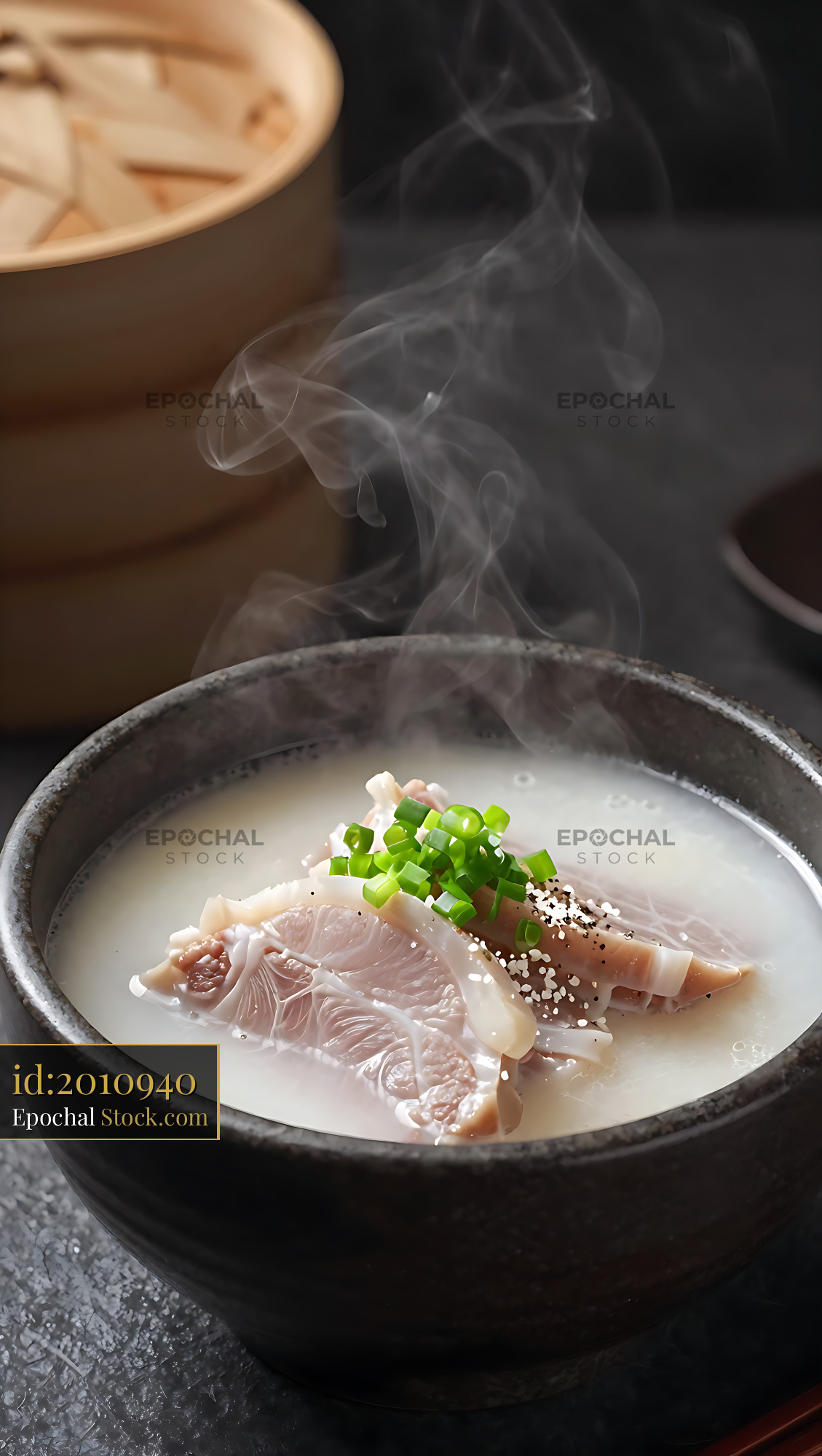 Steaming bowl of authentic Kagoshima Tonkotsu soup with pork belly - stock photo