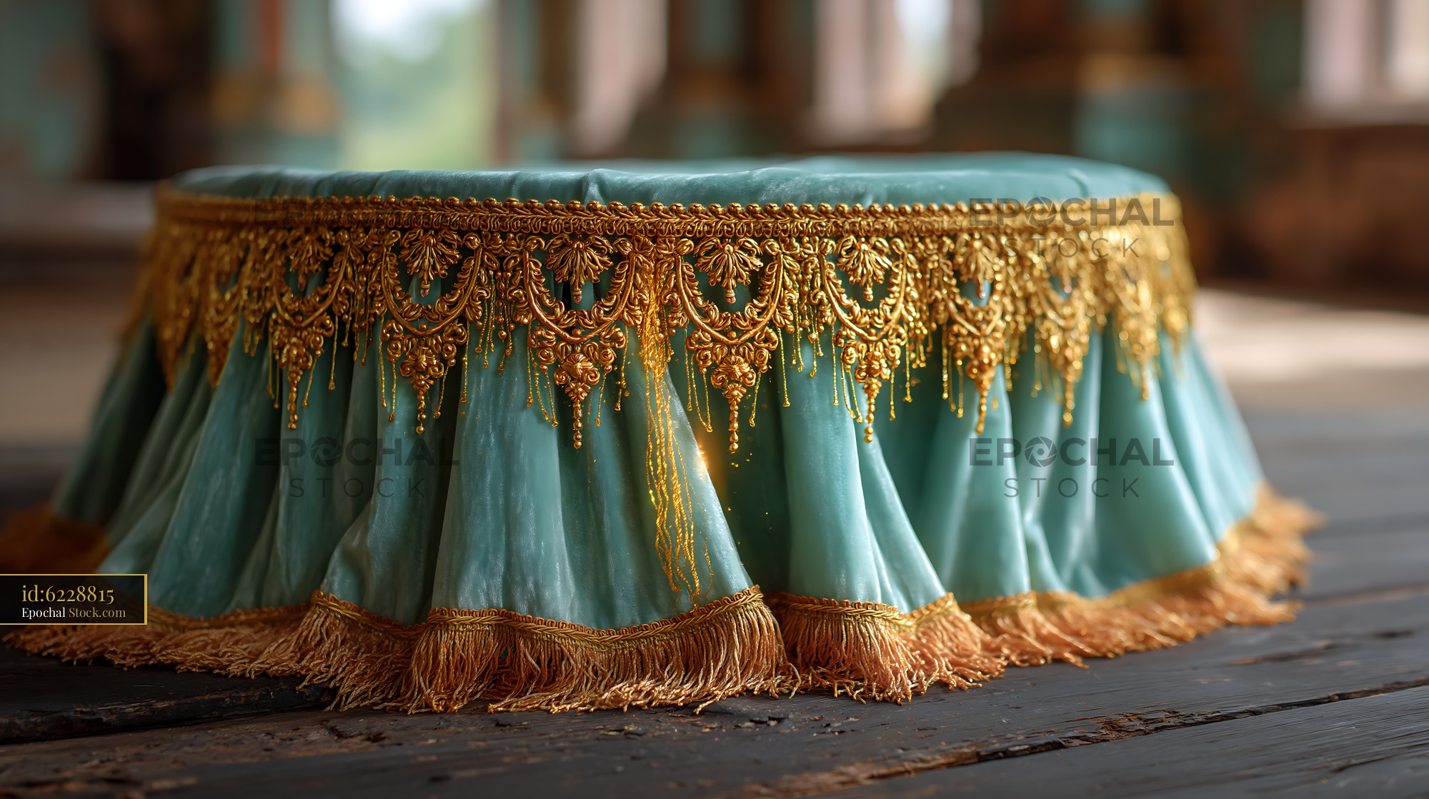 Teal velvet stage platform with ornate gold embroidery and fringe - stock photo