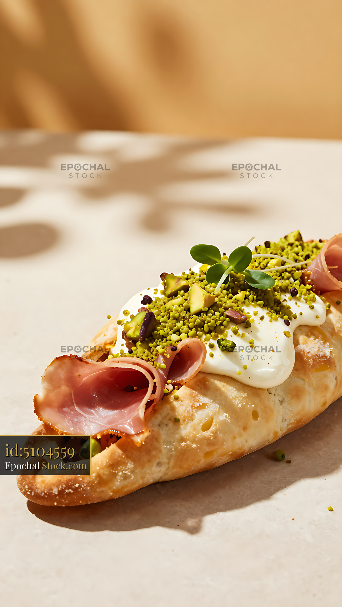 Gourmet calzone bianca with mortadella and pistachio topping - stock photo