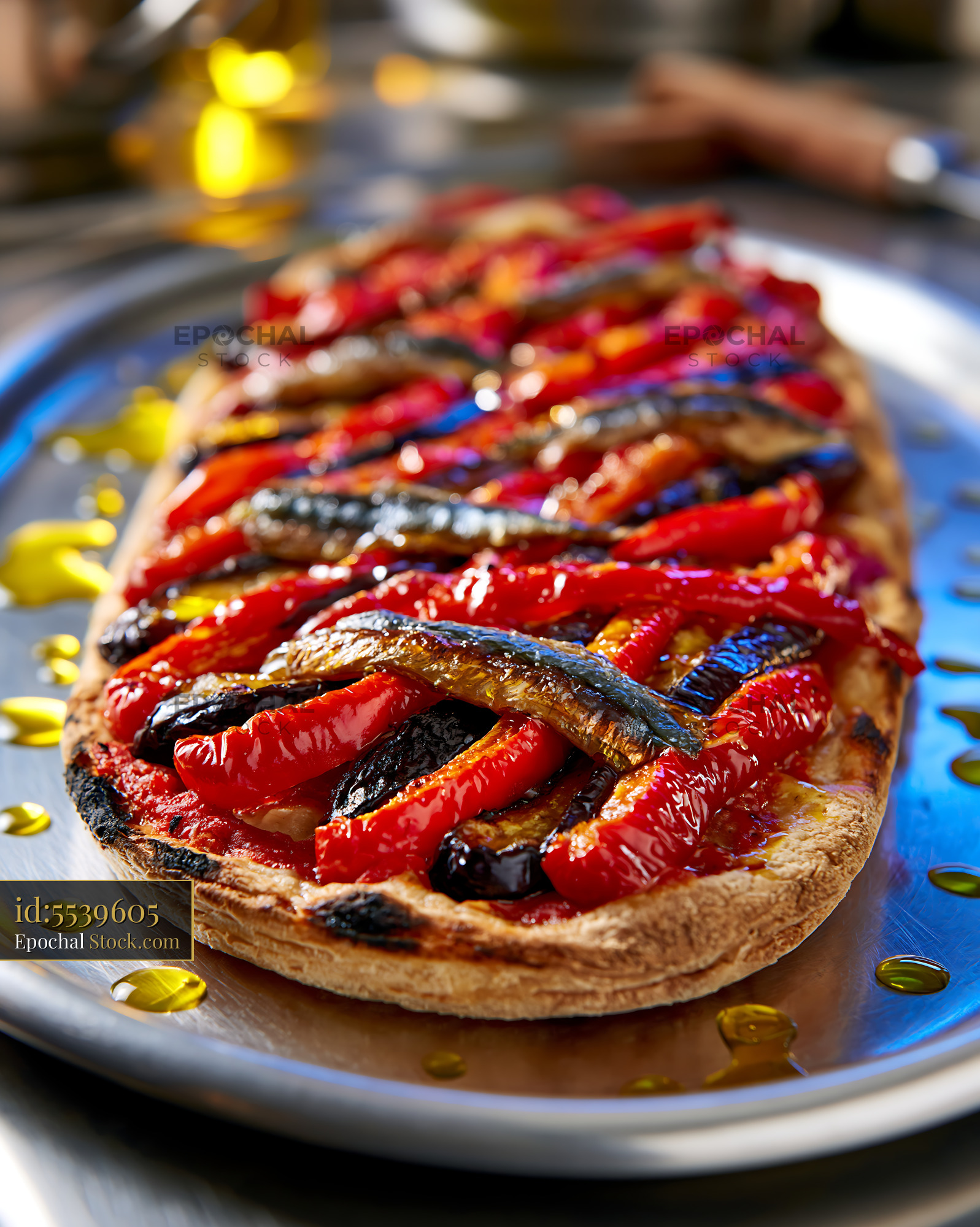 Traditional coca de recapte pizza topped with roasted peppers and sard - stock photo