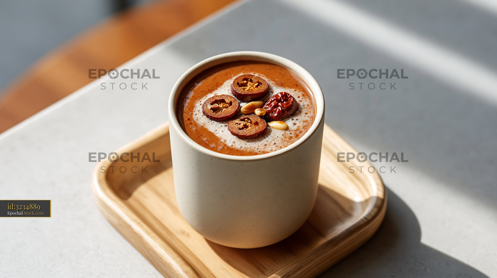 Daechu jujube smoothie with pine nuts on a wooden tray - stock photo