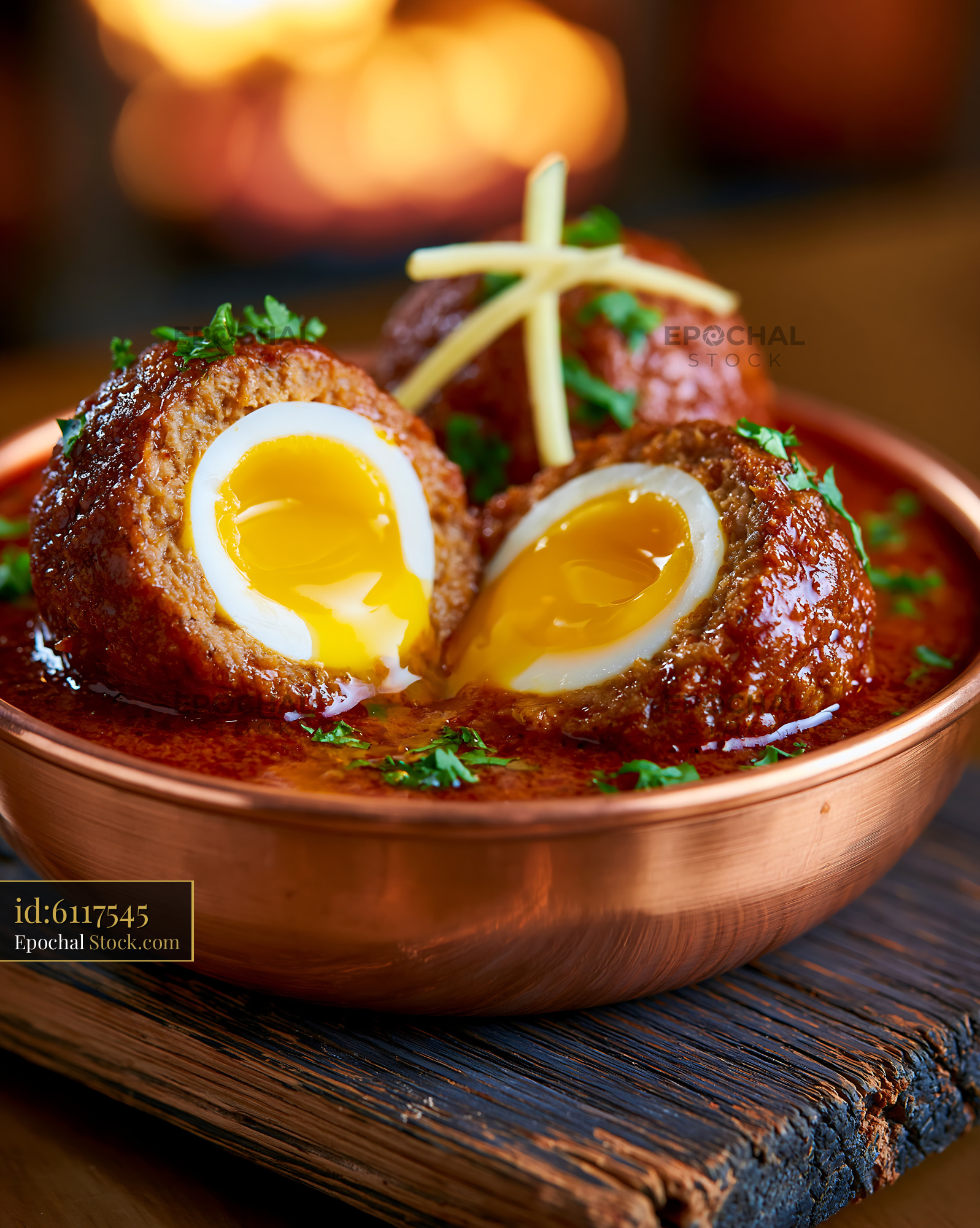 Nargisi kofta egg food served in a rustic copper bowl - stock photo
