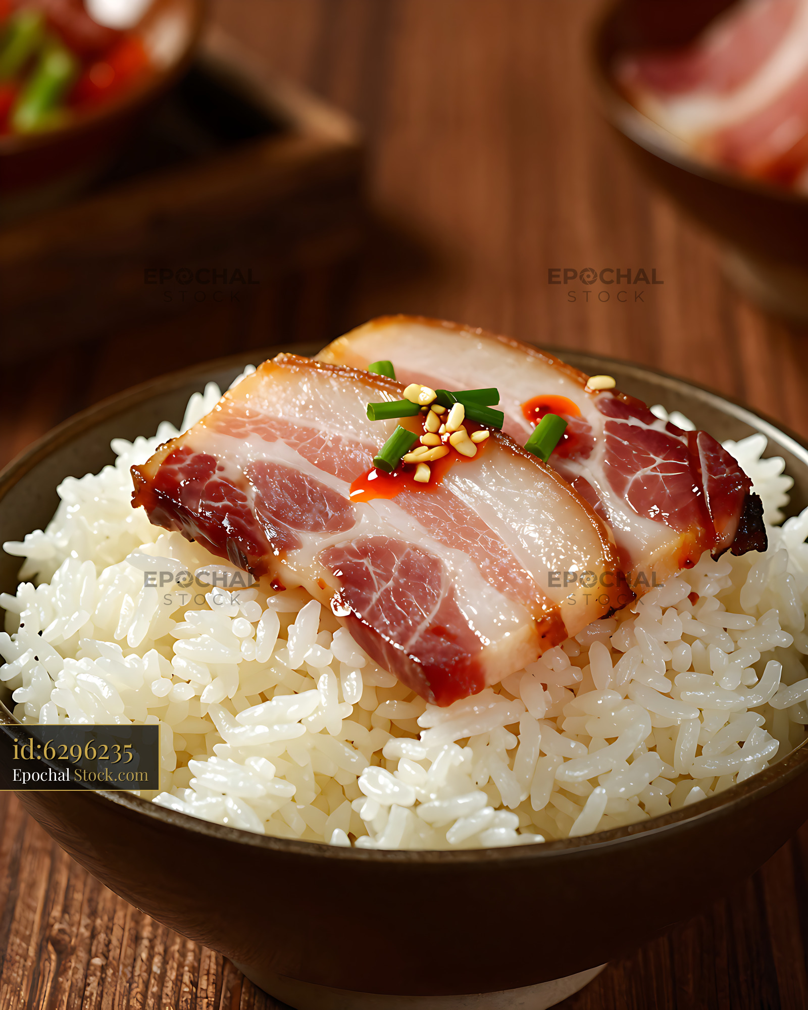 Yunnan Xuanwei ham slices on steamed white rice in a bowl - stock photo
