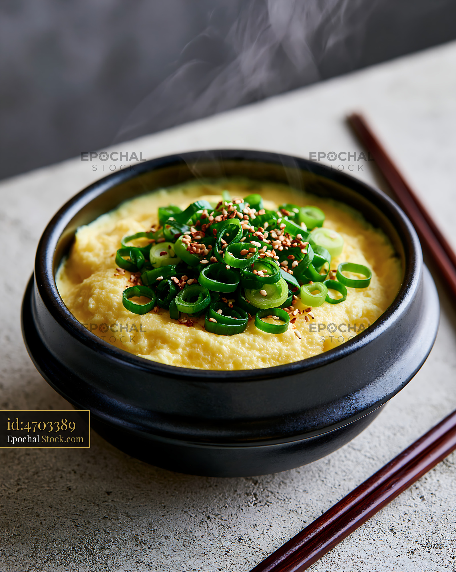 Korean steamed egg gyeran jjim with green onions and sesame - stock photo