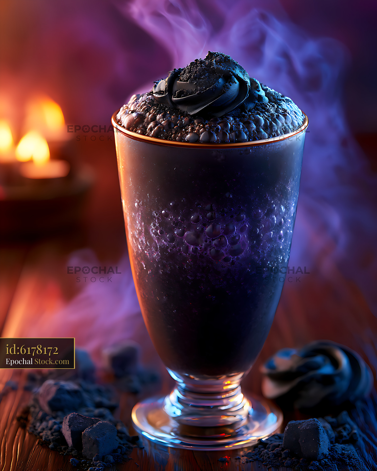 Charcoal black milkshake with purple smoke in a mystical setting - stock photo