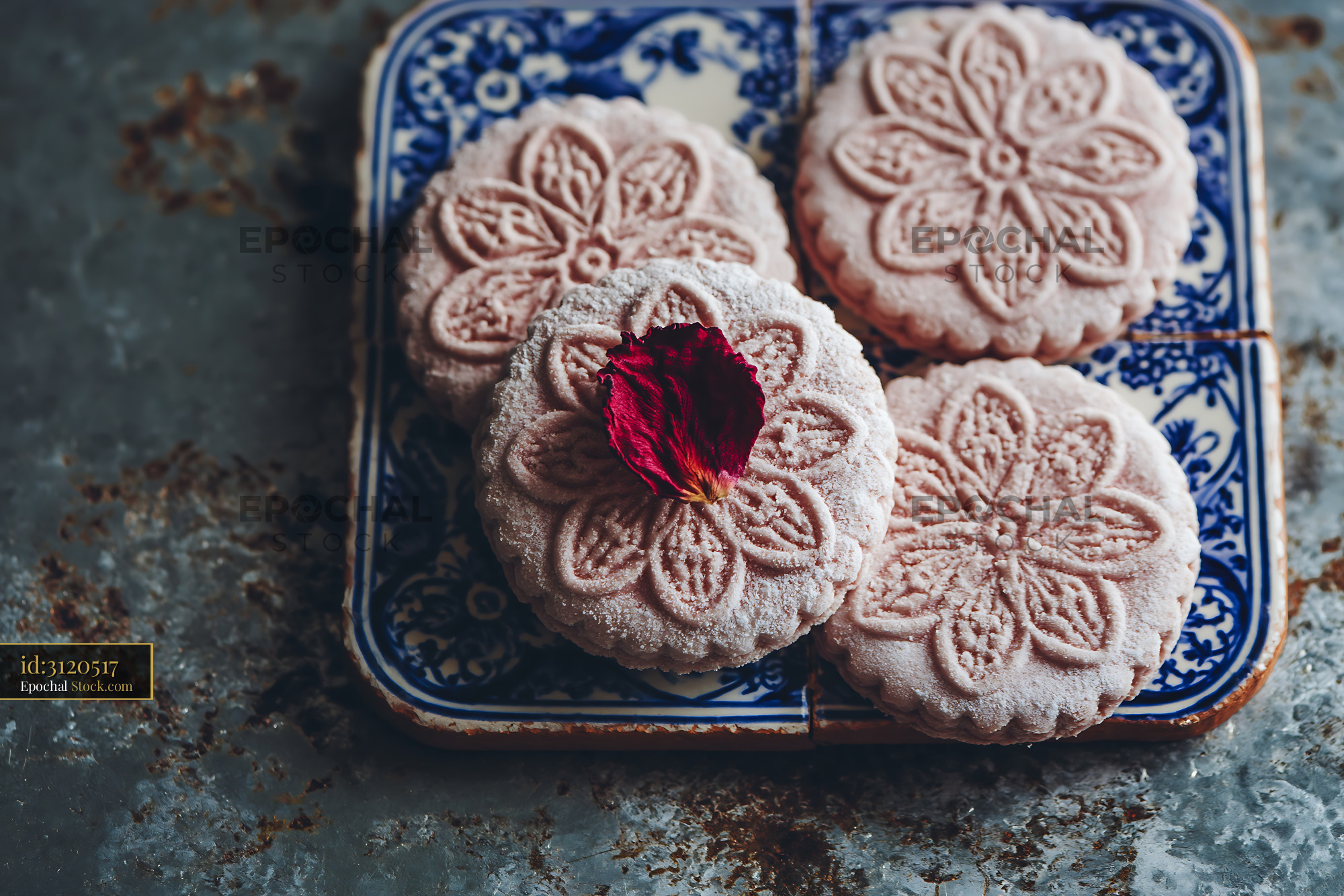 Artisan rose water biscuits with floral patterns on vintage tiles - stock photo