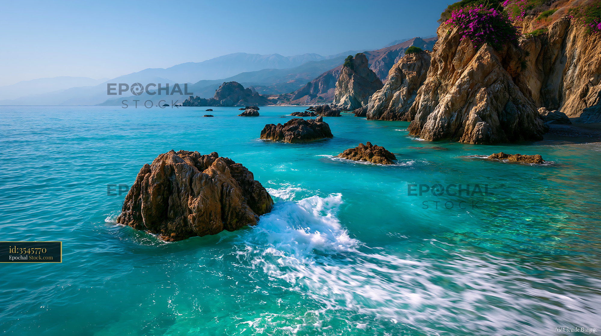 Turquoise water and rocky cliffs of a Mediterranean beach in Crete - stock photo