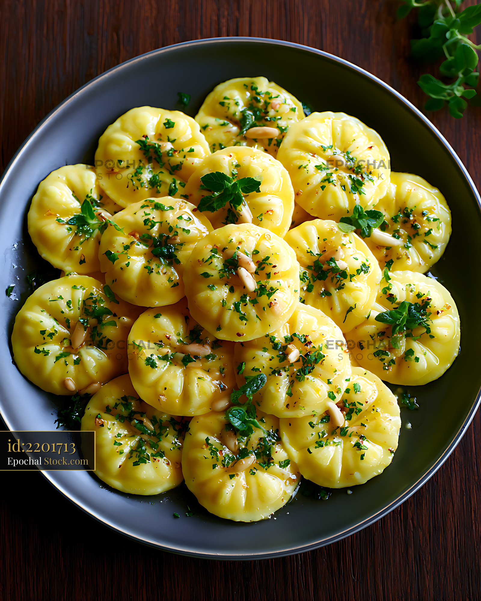 Homemade corzetti ligurian stamped pasta with fresh herbs and pine nut - stock photo