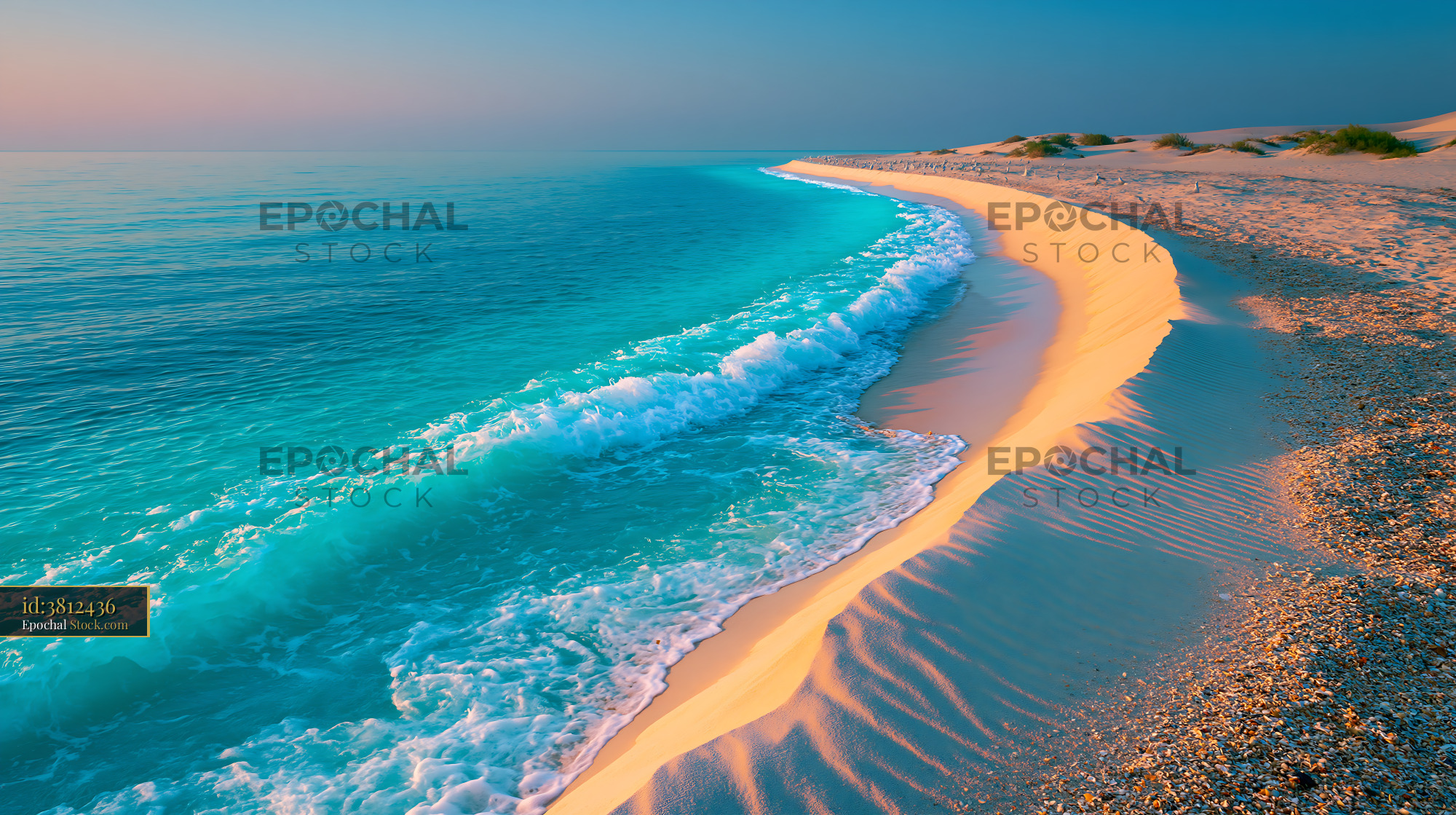 Turquoise ocean wave washing over a coastal dune curve at sunset - stock photo