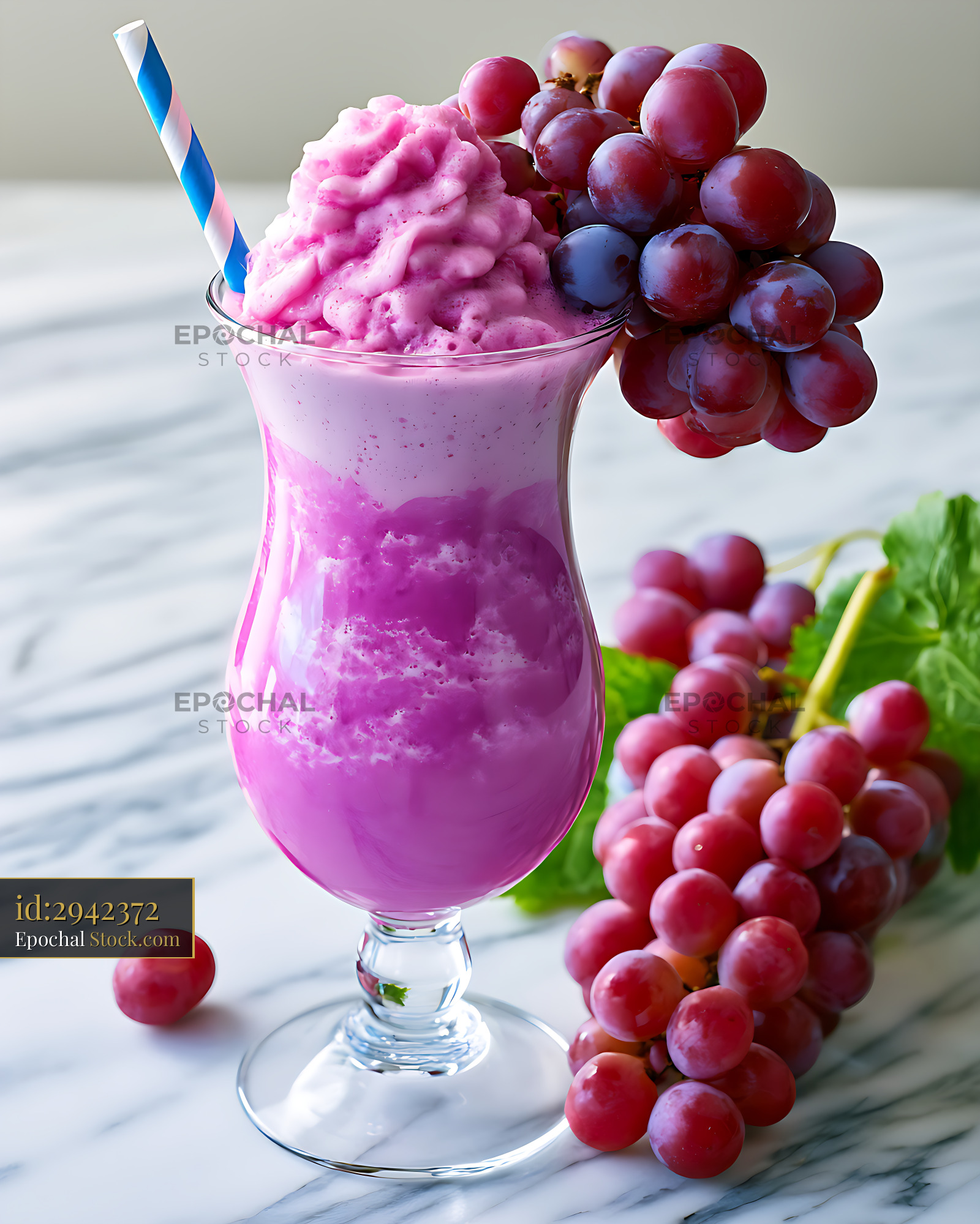 Purple grape soda milkshake with fresh fruit on marble surface - stock photo