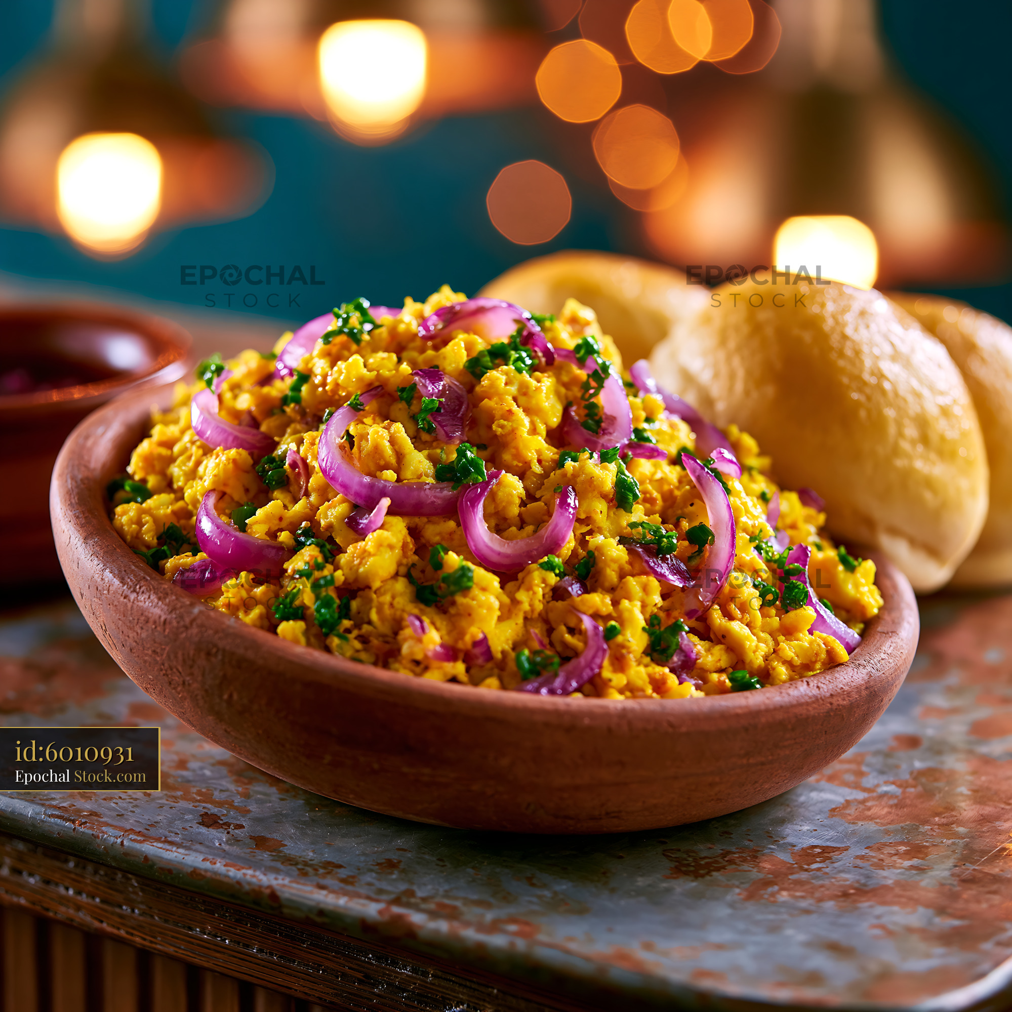 Indian egg bhurji with red onions and herbs served in a rustic bowl - stock photo