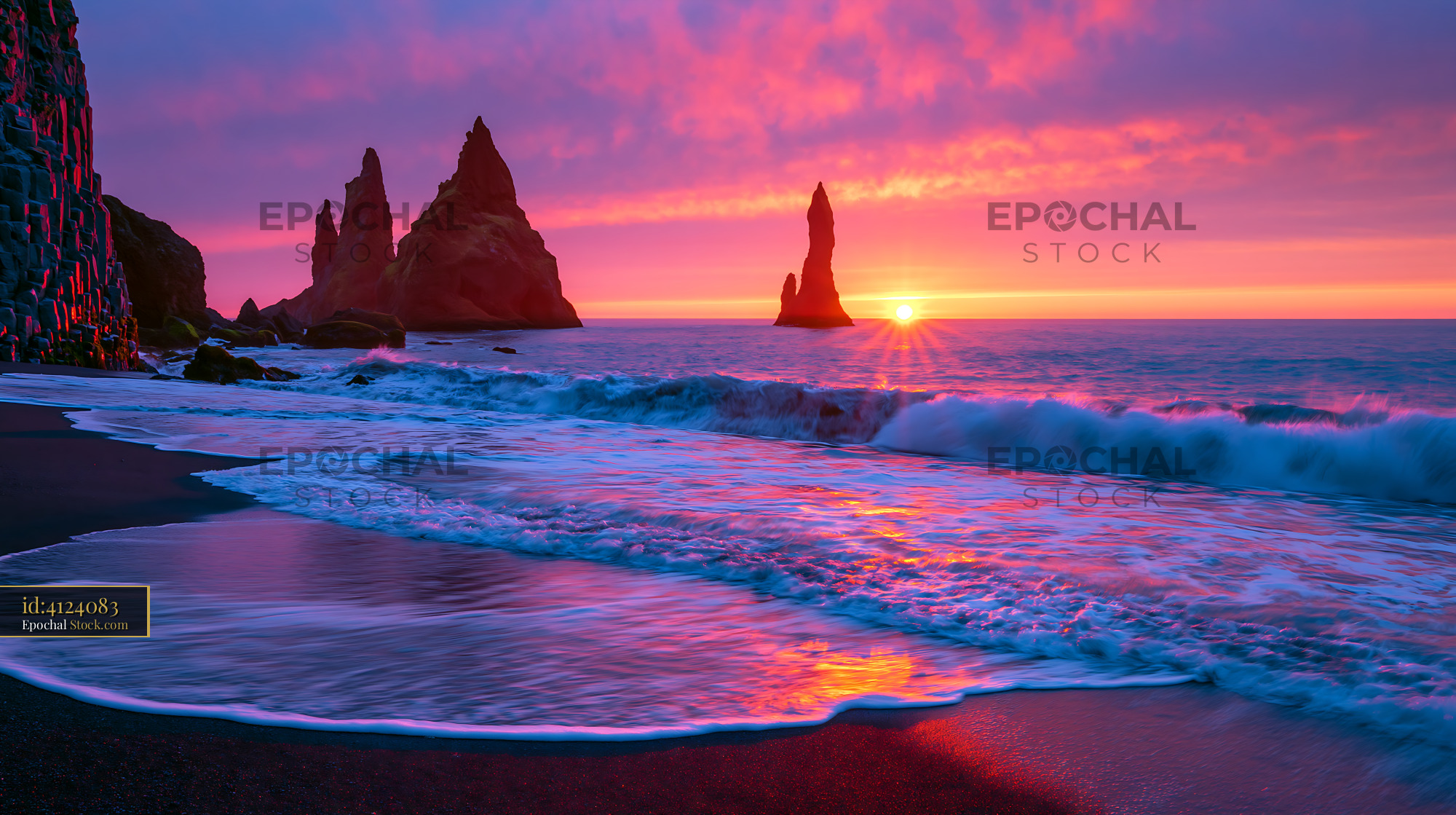 Sea stack basalt formations at sunset on a black sand beach - stock photo