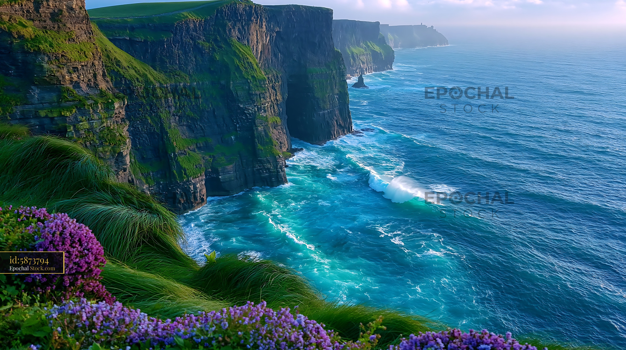 Majestic Cliffs of Moher overlooking the blue Atlantic Ocean - stock photo