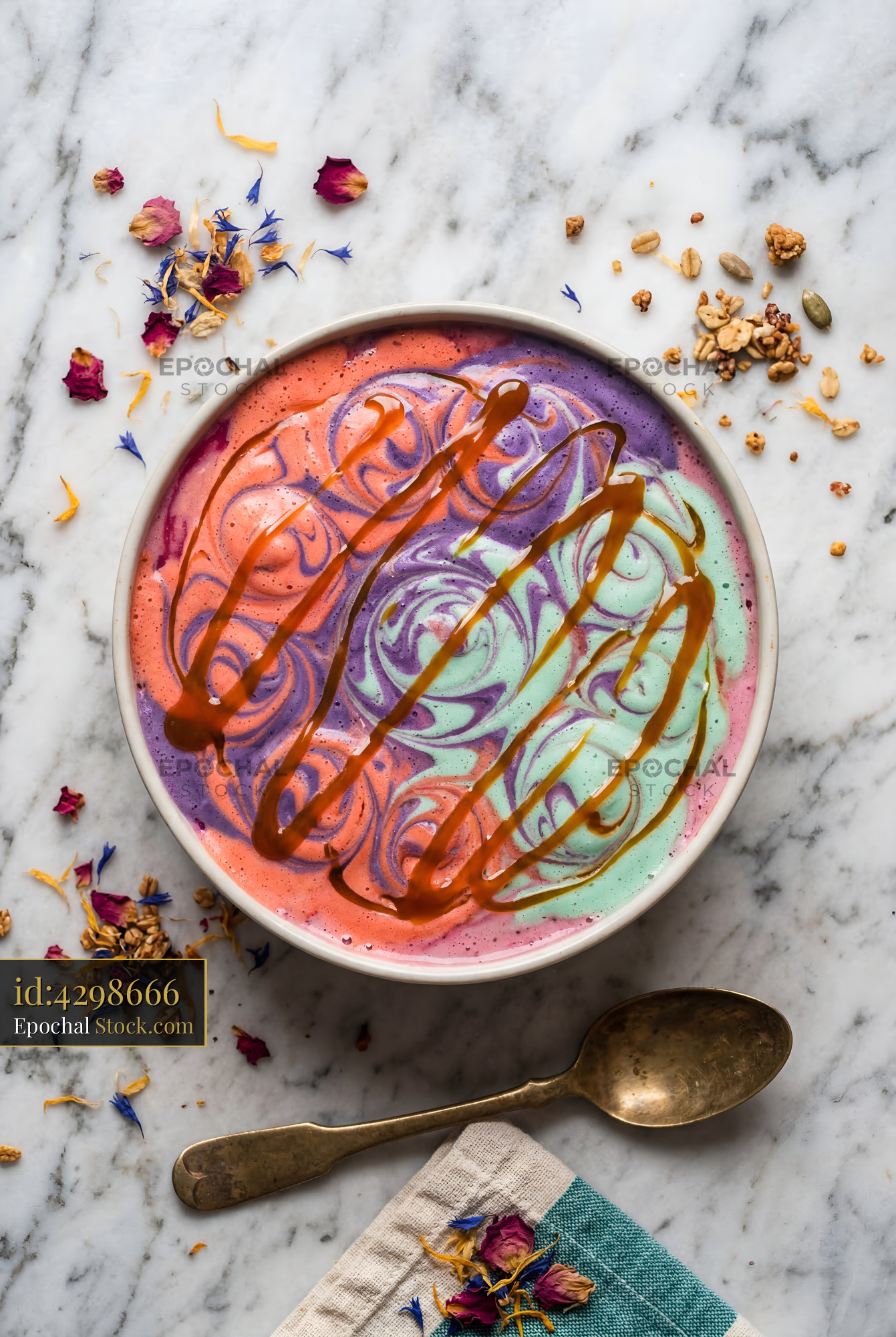 Colorful ice cream in a bowl with toppings on a table Premium Stock Photo - stock photo