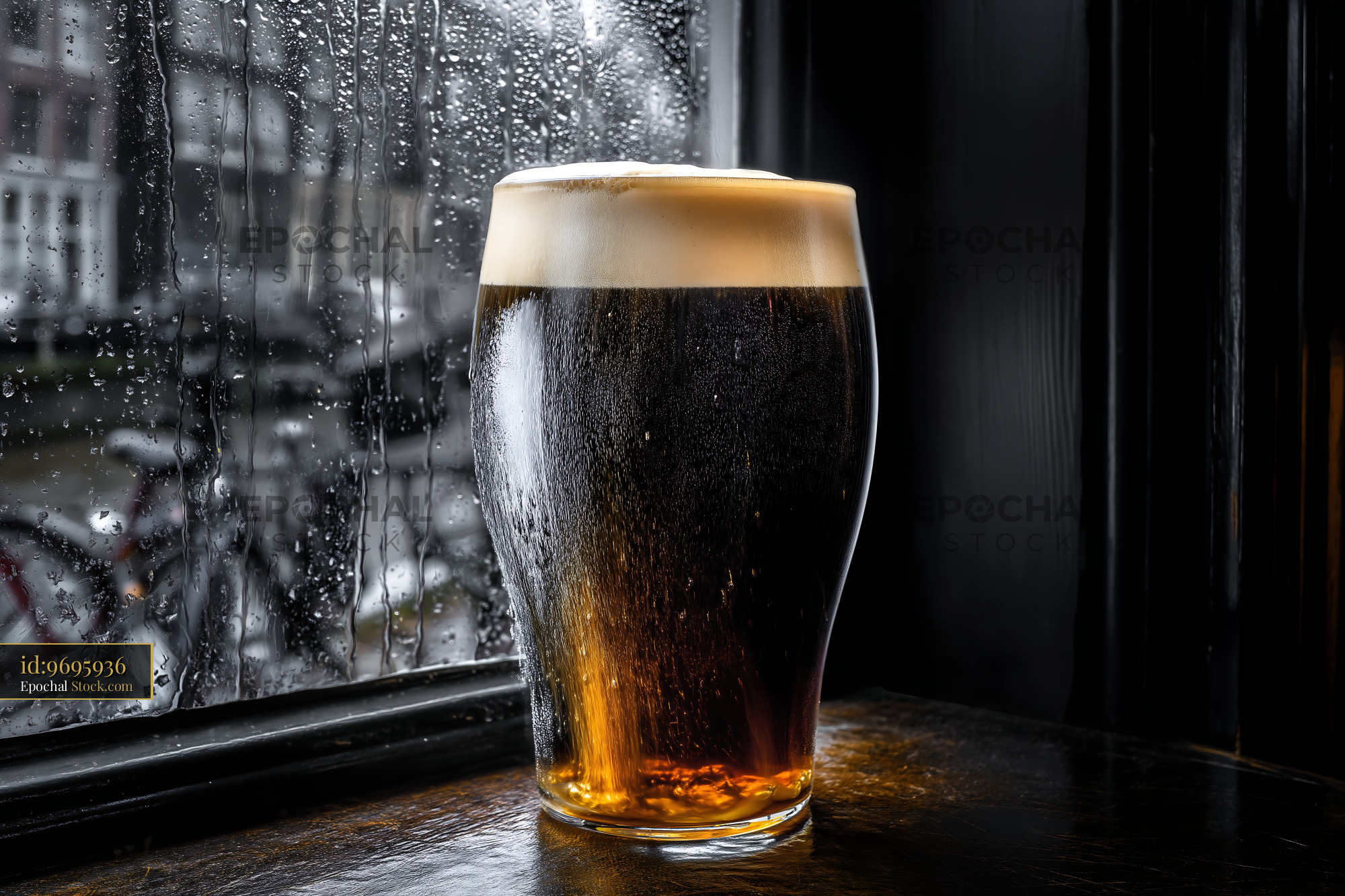 Cold Pint of Stout by Rainy Window - stock photo