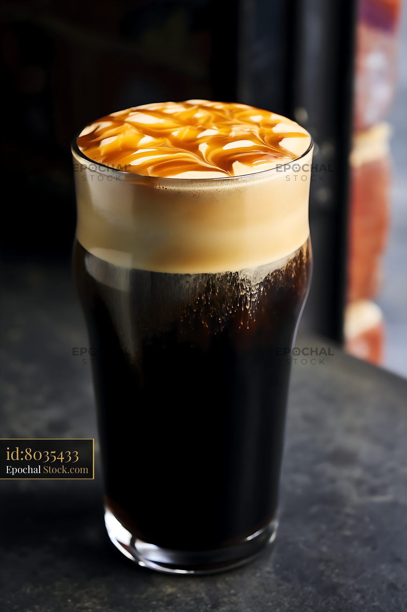 Iced Coffee with Caramel Drizzle and Foam - stock photo