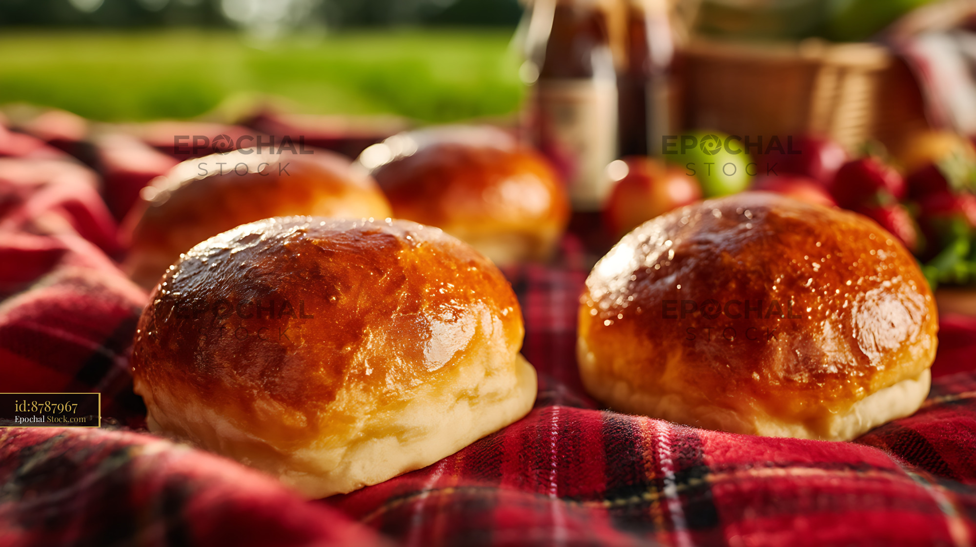 Golden Dinner Rolls on Picnic Blanket - stock photo