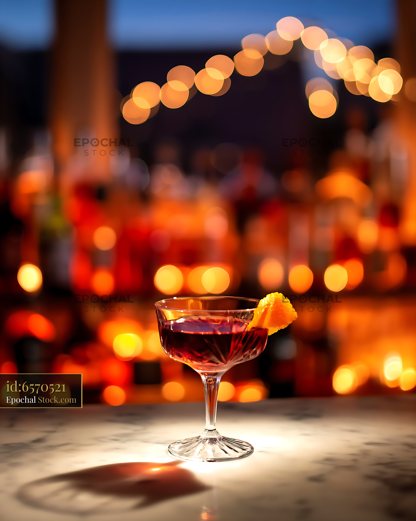 Cocktail with Citrus Peel Against Blurred Bar Bokeh - stock photo