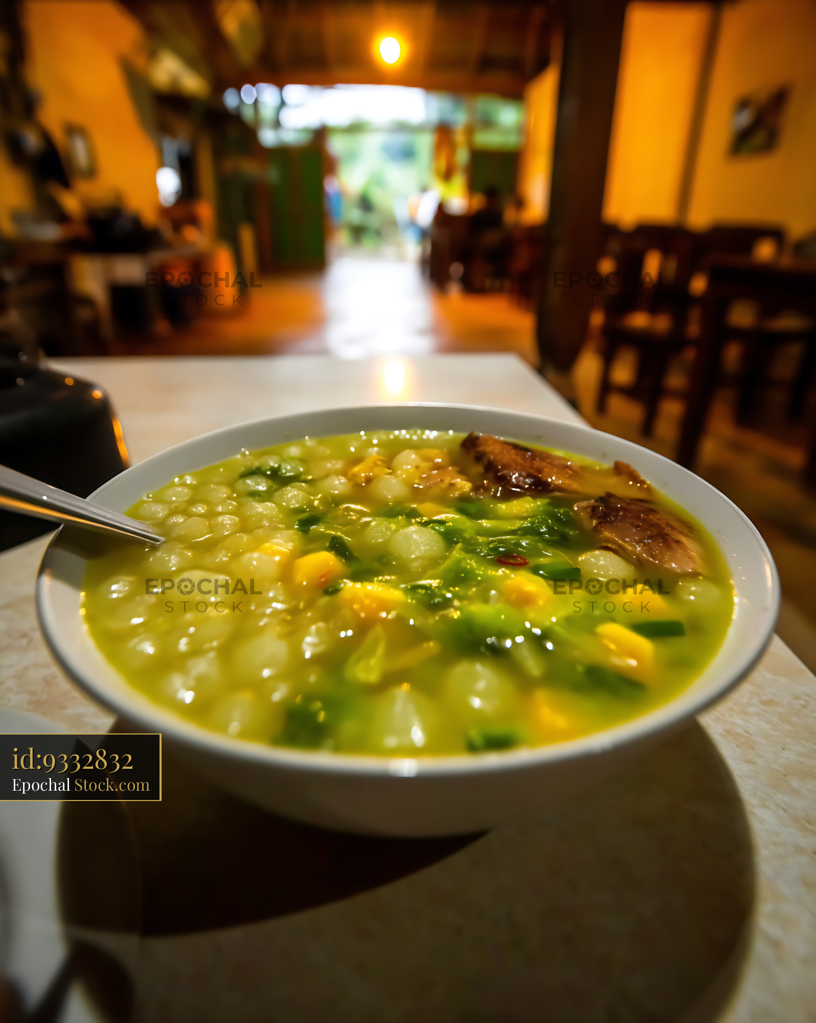 Kapurung Soup Bowl on Table in Cozy Eatery - stock photo