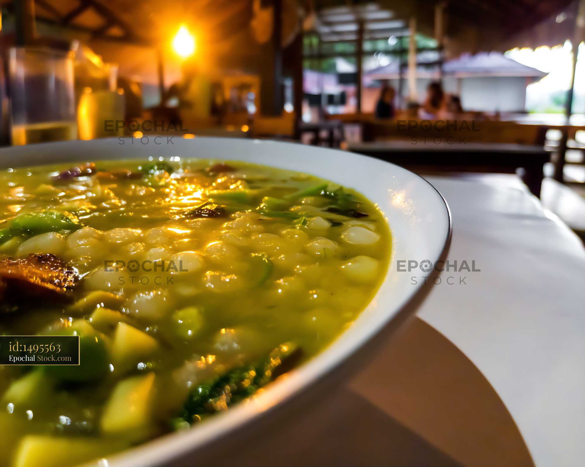 Close-up of Warm Kapurung Soup in Evening Restaurant - stock photo